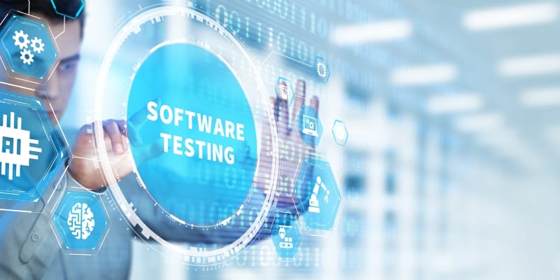 A software tester operatind a virtual display with the inscription 'SOFTWARE TESTING' illustrates mastering the vital skiils of software testing.