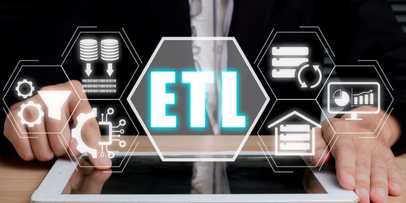 Image of a person using digital tablet with ETL-extract transform load icon on virtual screen illustrates becoming an ETL Tester.