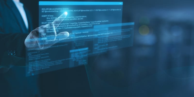 An IT programmer touching virtual screen with code segments explains mastering MongoDB.